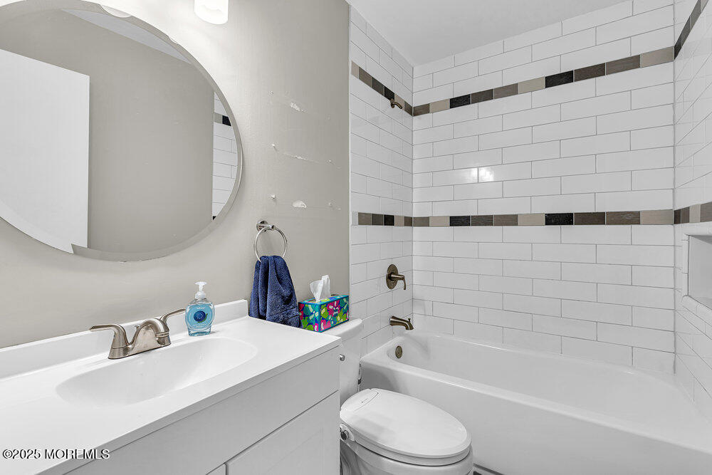 41 Sweetbriar Trail Howell, NJ 07731 - Photo 8 of 11 a bathroom with a sink mirror toilet and bathtub