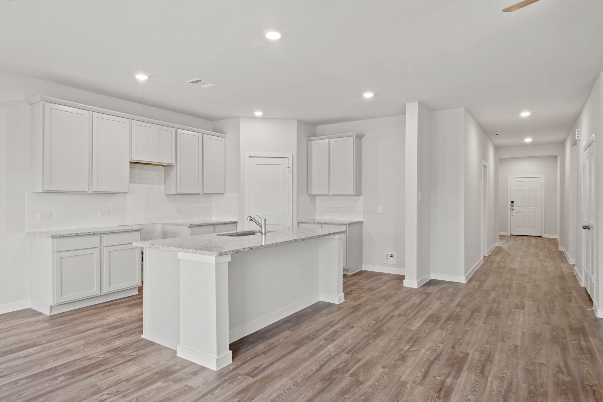 536 Shoreview Drive Conroe, TX 77303 - Photo 4 of 27 a kitchen with a sink stove and cabinets