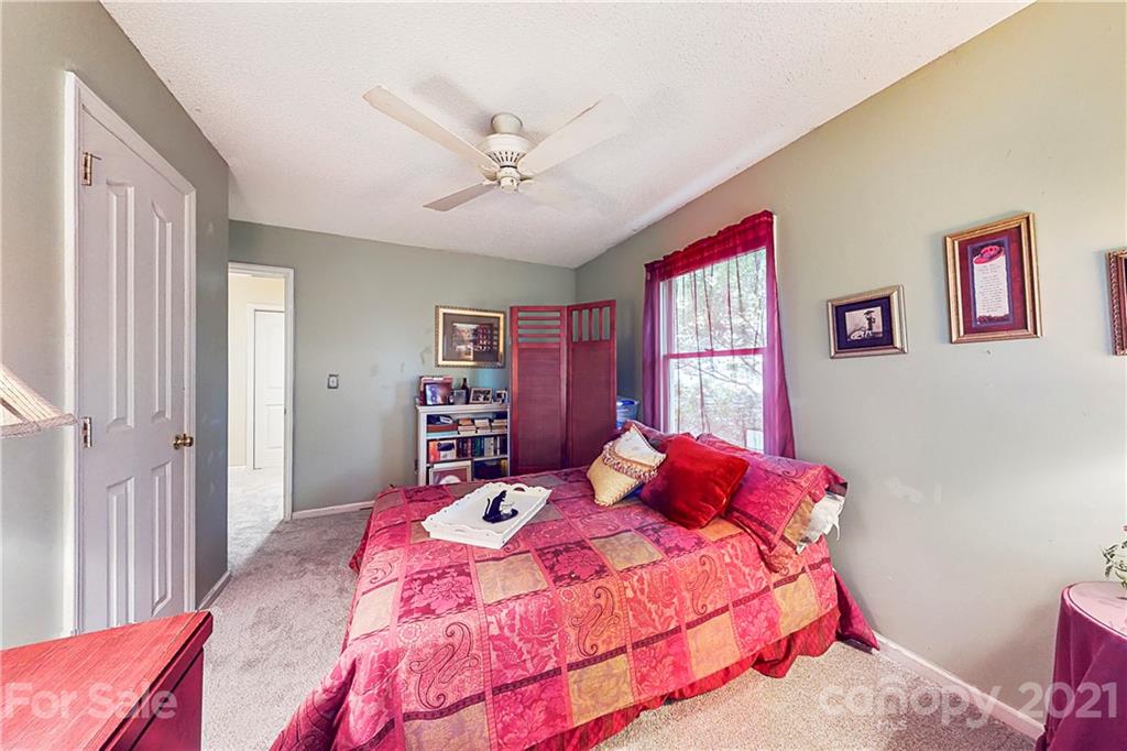 27036 Fahleh Cove Tega Cay, SC 29708 - Photo 16 of 21 a bedroom with a bed and a window