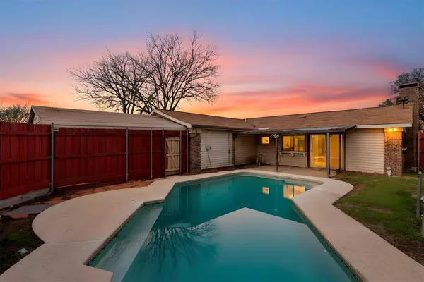 a swimming pool view with a outdoor space