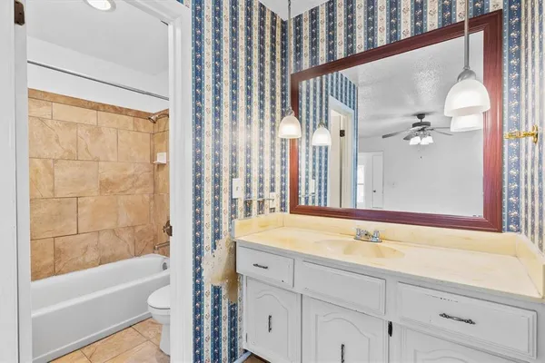 a bathroom with a tub and a sink