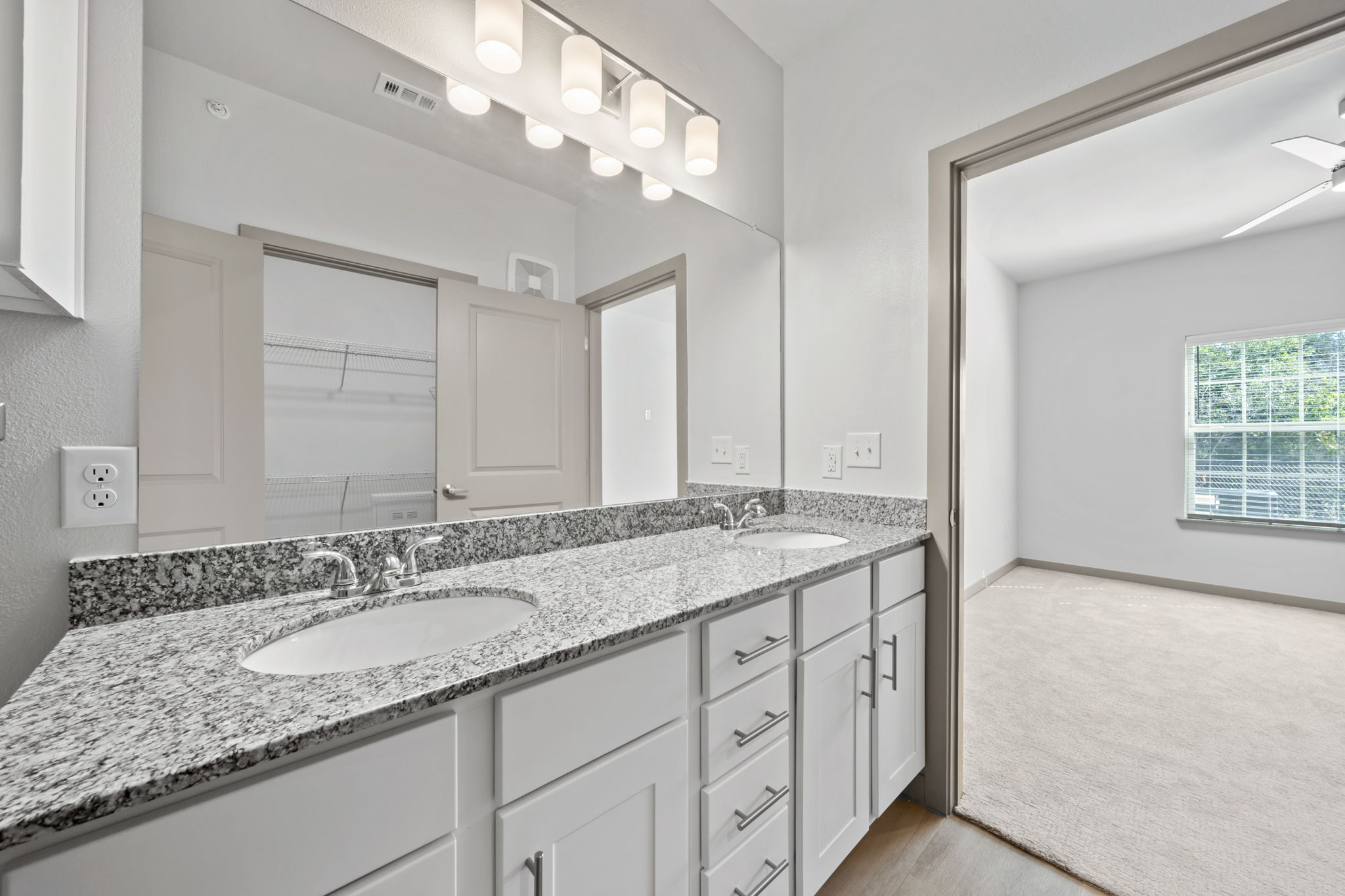 691 Union Chapel Road, Unit S1 Cedar Creek, TX 78612 - Photo 12 of 28 a bathroom with a granite countertop double vanity sink and mirror
