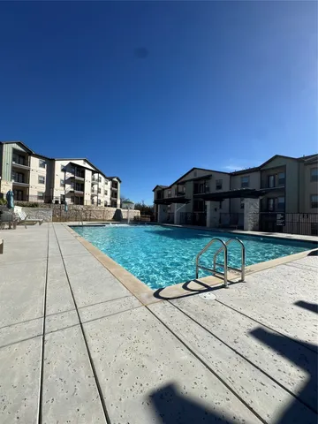 a view of a large building with a yard