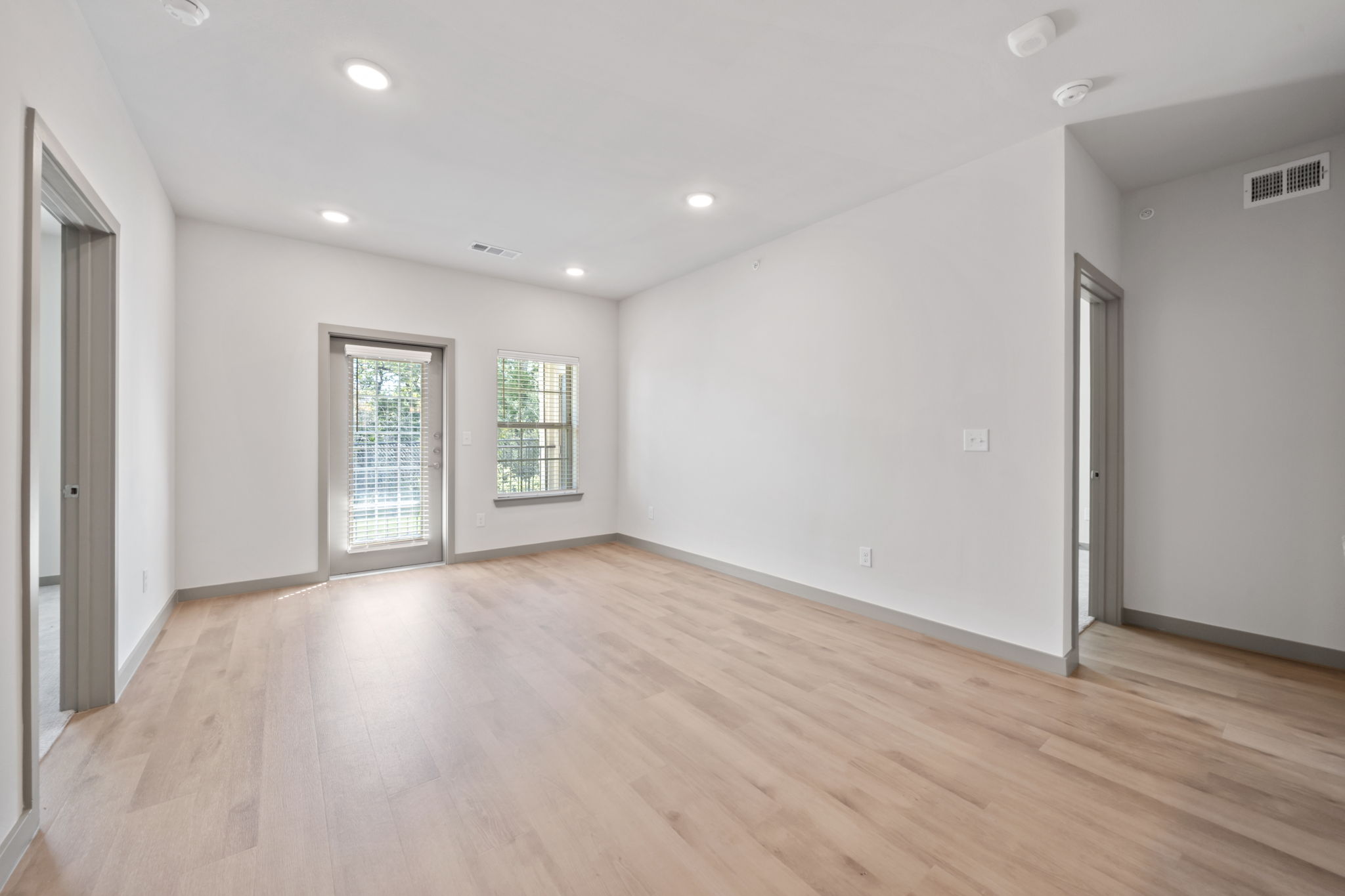691 Union Chapel Road, Unit S1 Cedar Creek, TX 78612 - Photo 5 of 28 a view of an empty room with wooden floor and a window