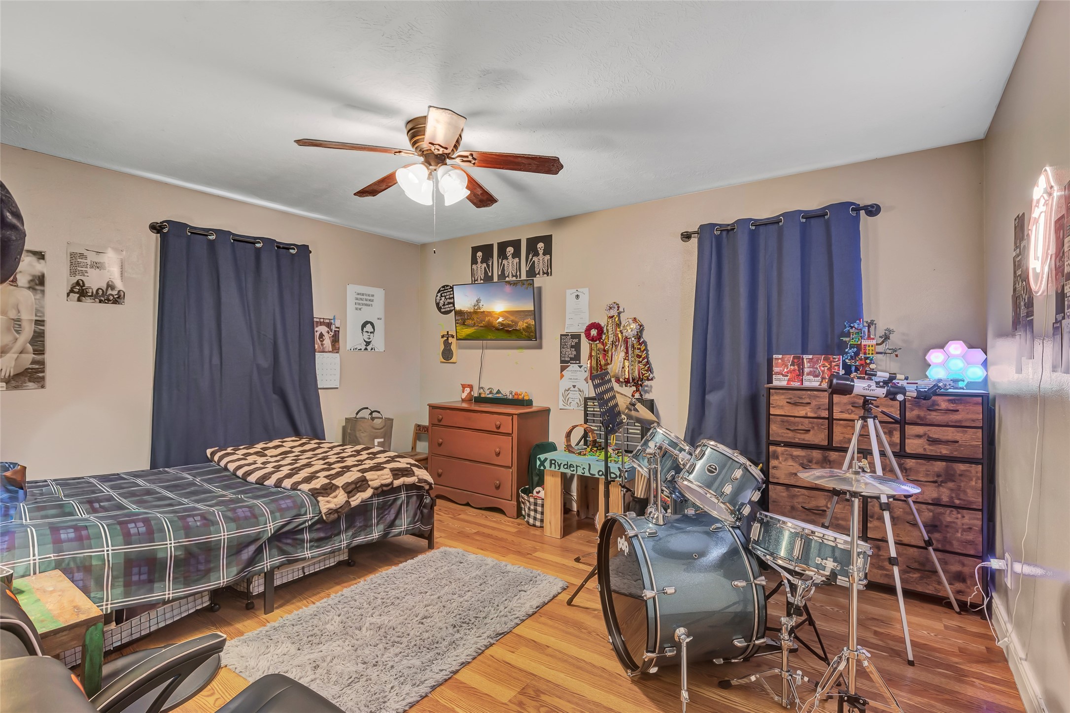 97 County Road 2268 Cleveland, TX 77327 - Photo 21 of 36 a bedroom with a bed and wooden floor