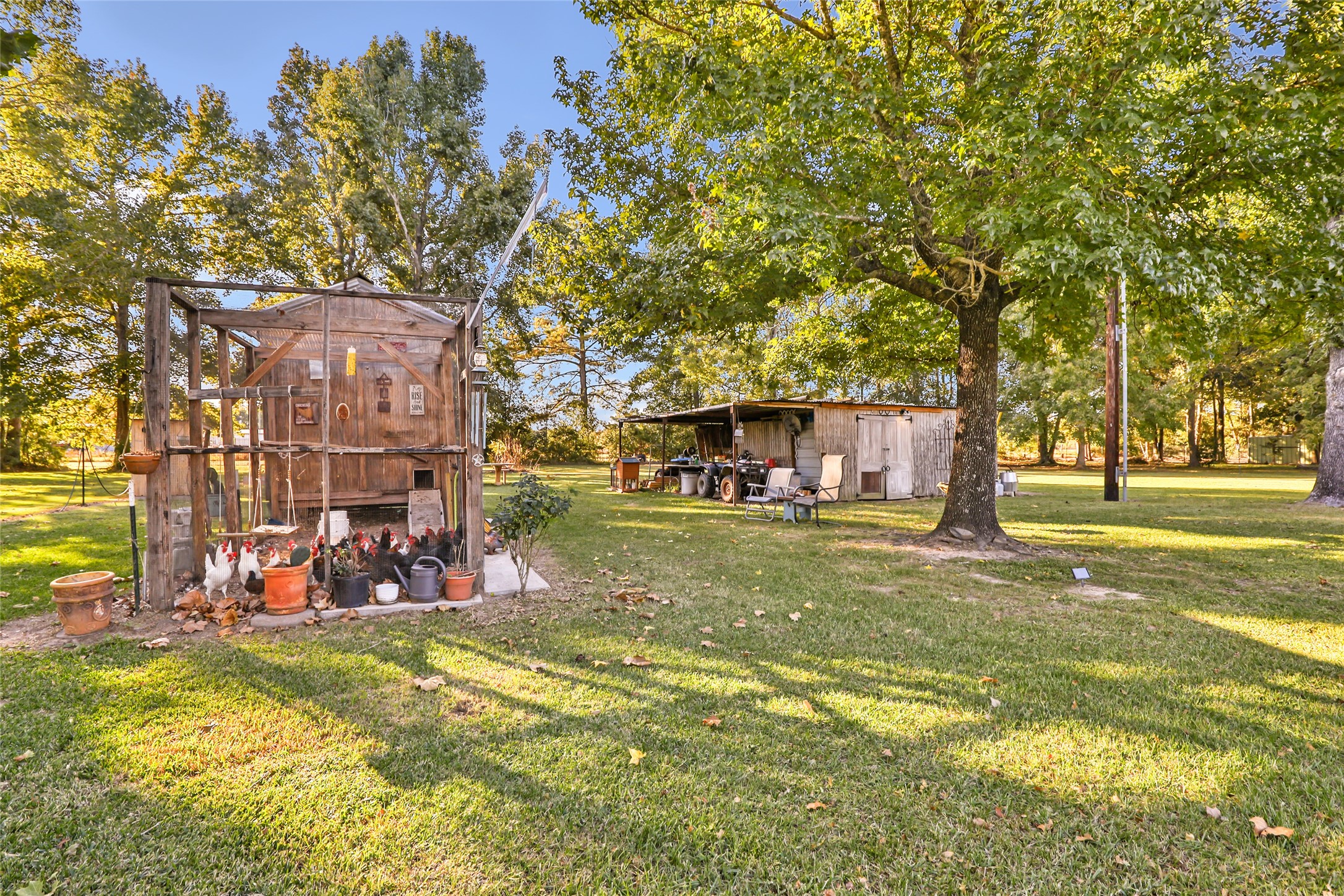 97 County Road 2268 Cleveland, TX 77327 - Photo 25 of 36 a view of outdoor space with garden