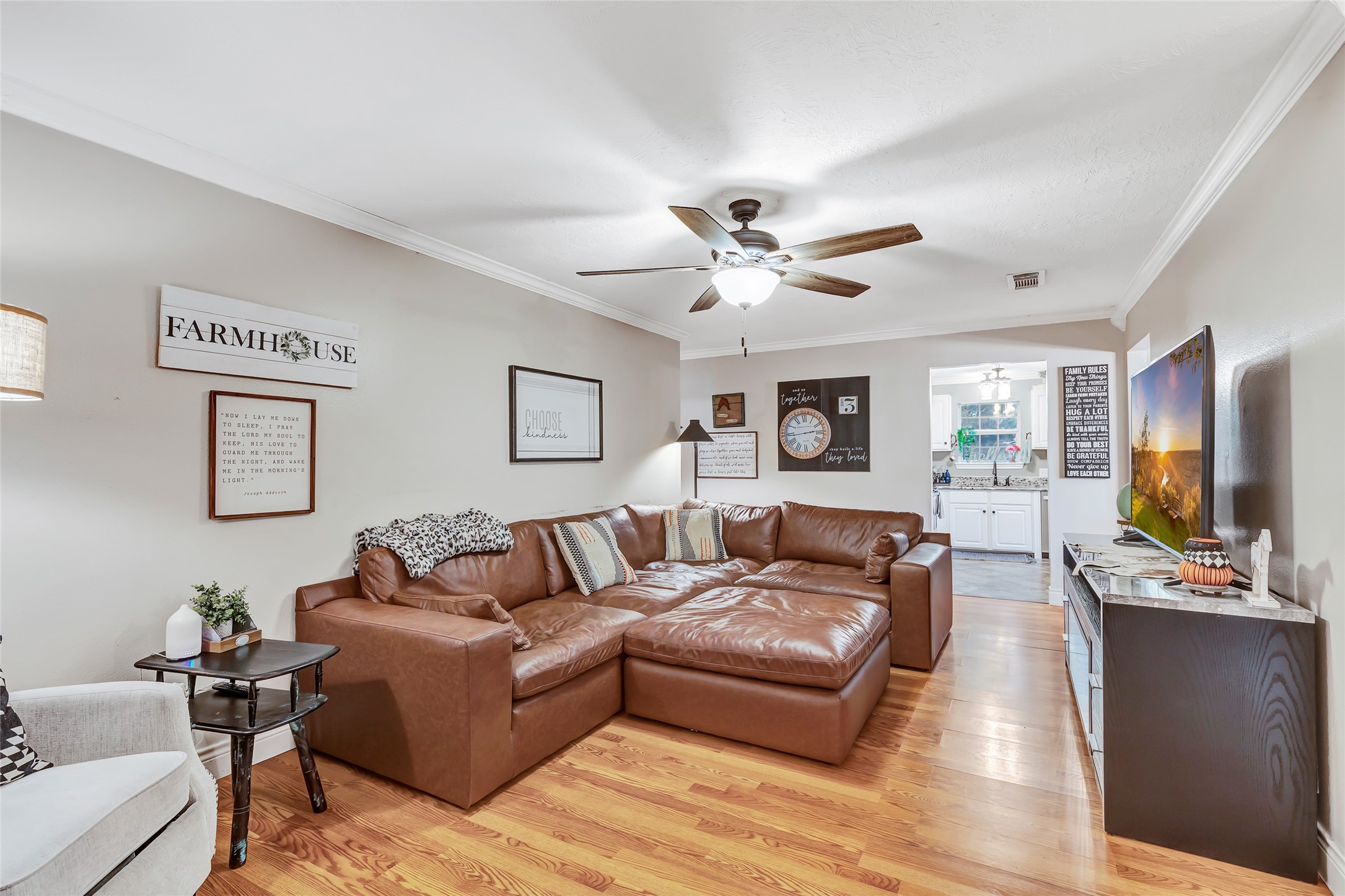 97 County Road 2268 Cleveland, TX 77327 - Photo 6 of 36 a living room with furniture flat screen tv and wooden floor