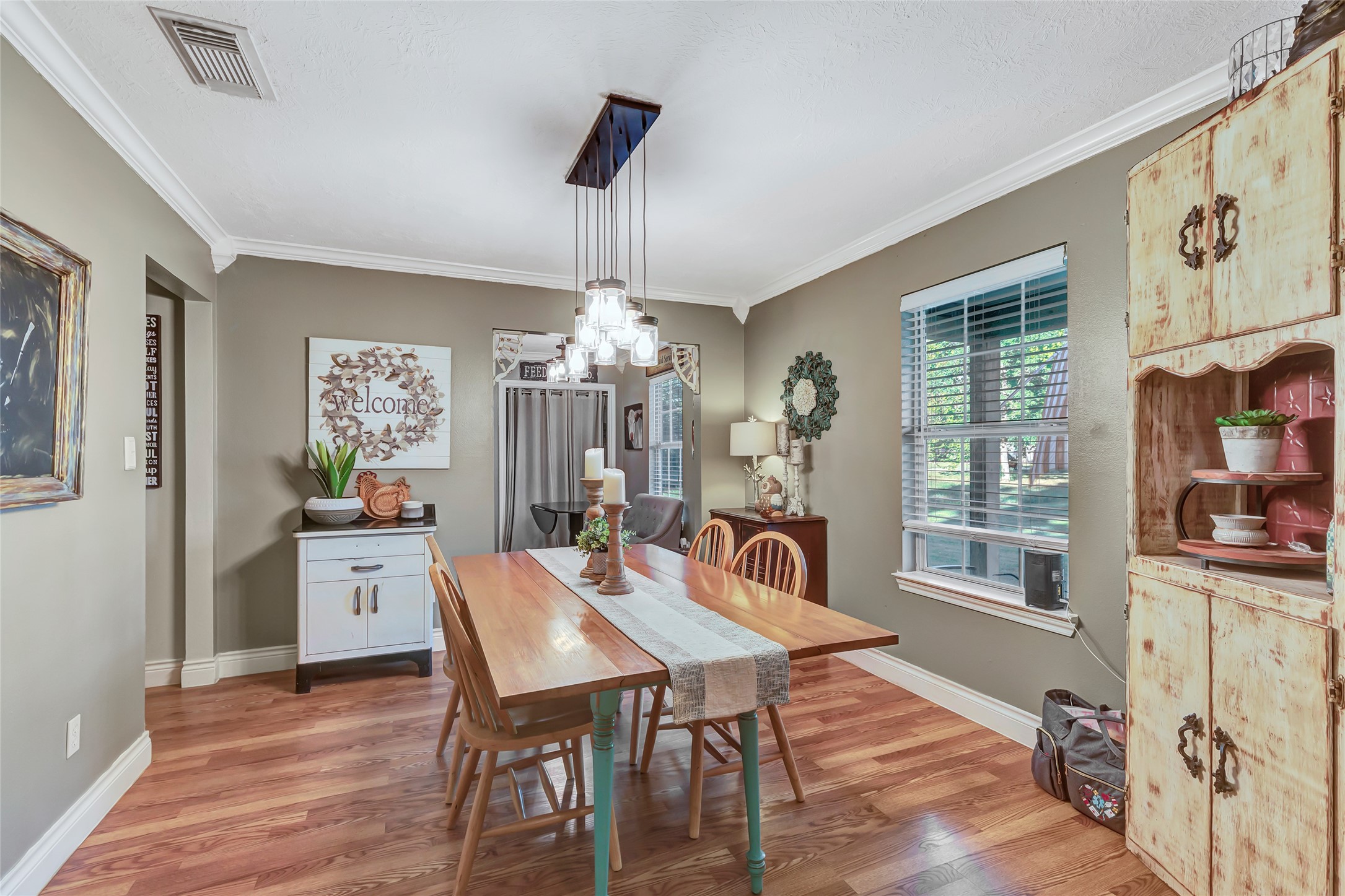 97 County Road 2268 Cleveland, TX 77327 - Photo 7 of 36 a view of a dining room with furniture window and wooden floor