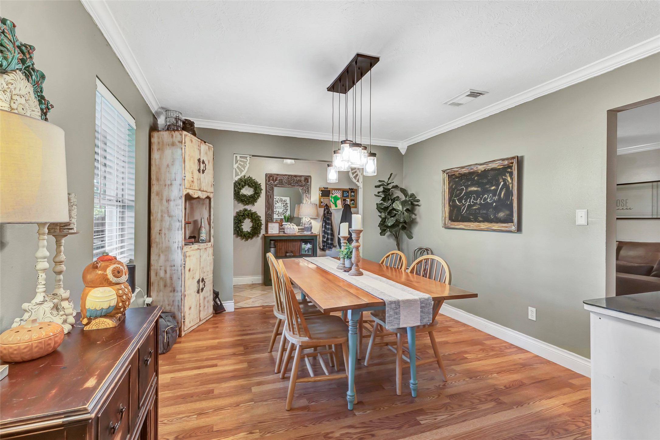 97 County Road 2268 Cleveland, TX 77327 - Photo 8 of 36 a view of a dining room with furniture window and wooden floor