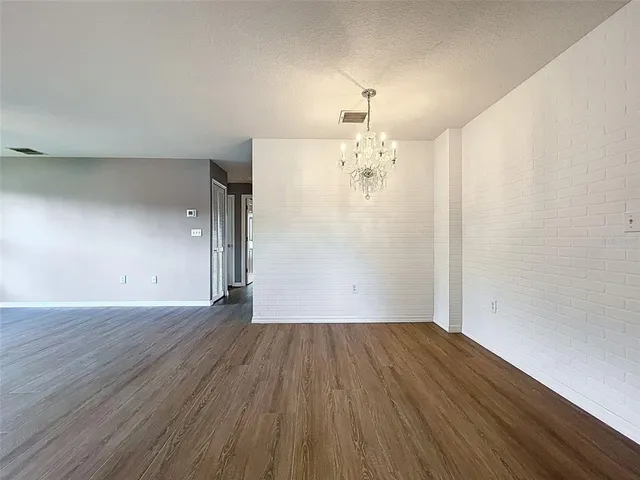a kitchen with a sink window and cabinets