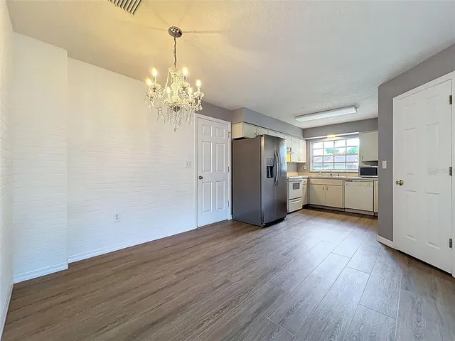 a view of bathroom with a toilet sink and a mirror