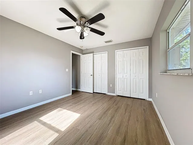 a view of an empty room with a large window