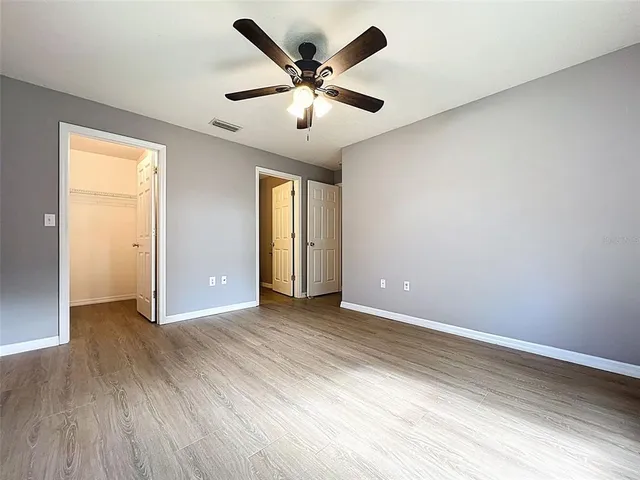 a view of a house with yard and tree s