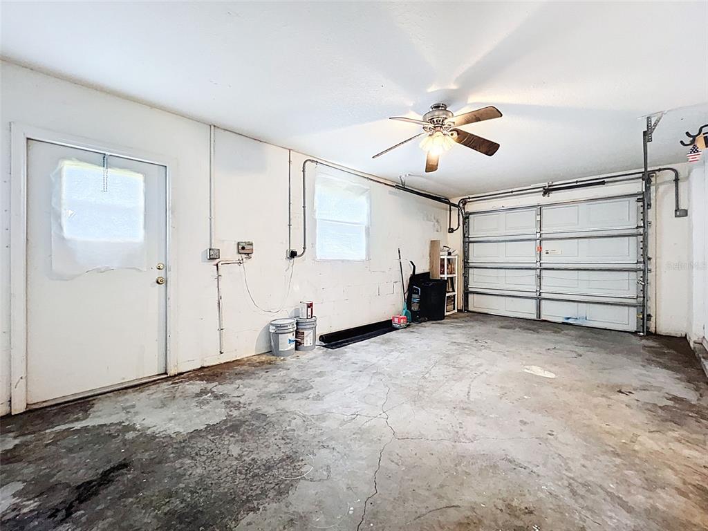 12214 Partridge Hill Row Hudson, FL 34667 - Photo 59 of 80 a view of a room with closet and ceiling fan