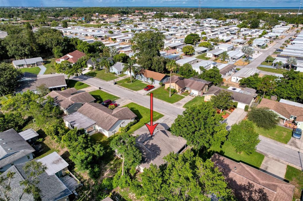 12214 Partridge Hill Row Hudson, FL 34667 - Photo 71 of 80 an aerial view of residential houses with outdoor space