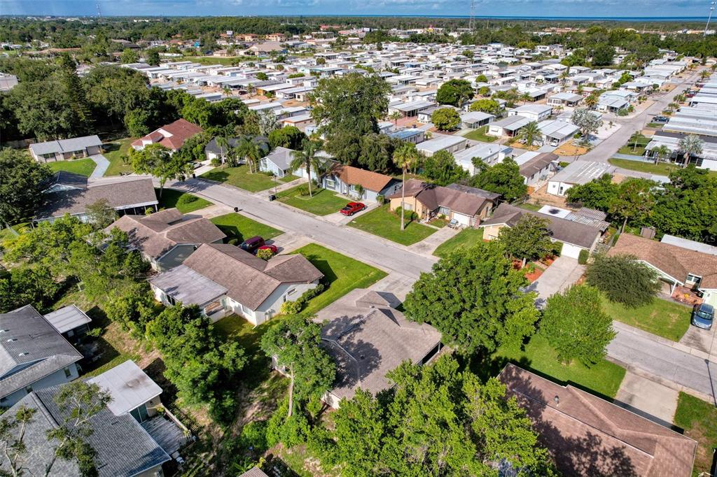 12214 Partridge Hill Row Hudson, FL 34667 - Photo 72 of 80 an aerial view of residential houses with outdoor space