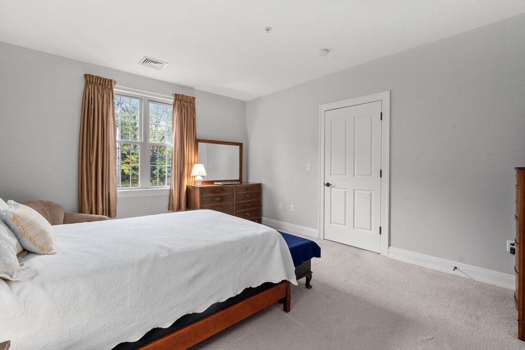 59 Walpole Street, Unit 210 Canton, MA 02021 - Photo 16 of 42 a bedroom with a bed and a window