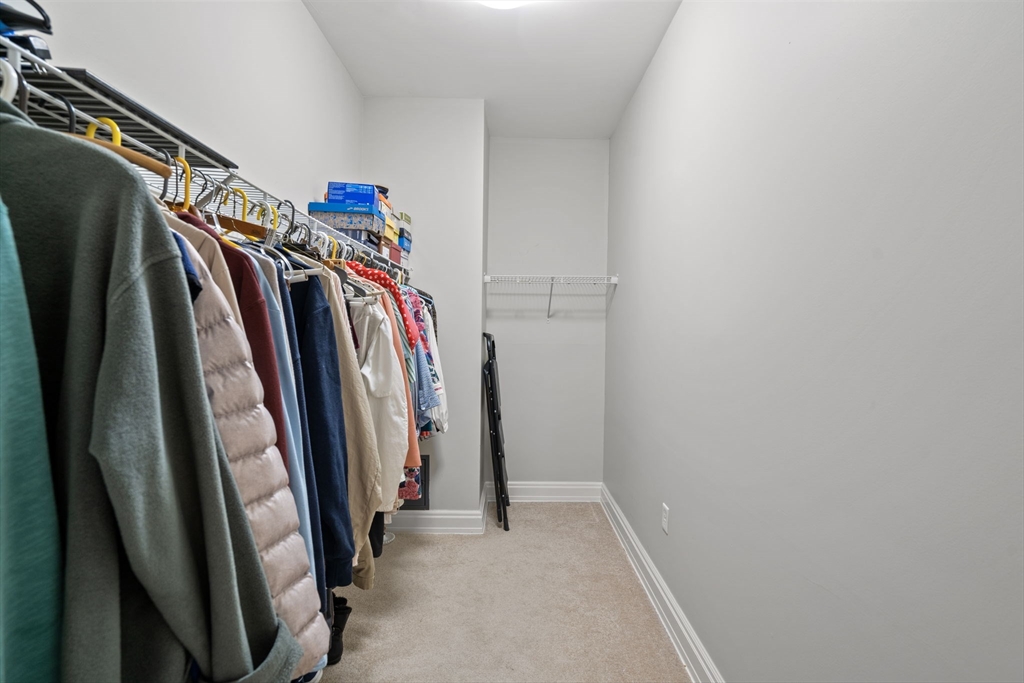 59 Walpole Street, Unit 210 Canton, MA 02021 - Photo 19 of 42 a view of walk in closet with clothes