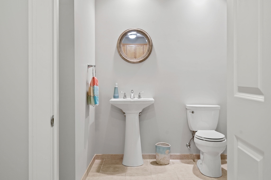 59 Walpole Street, Unit 210 Canton, MA 02021 - Photo 22 of 42 a bathroom with a toilet and a sink
