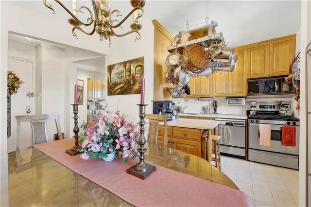 a kitchen that has a lot of cabinets in it