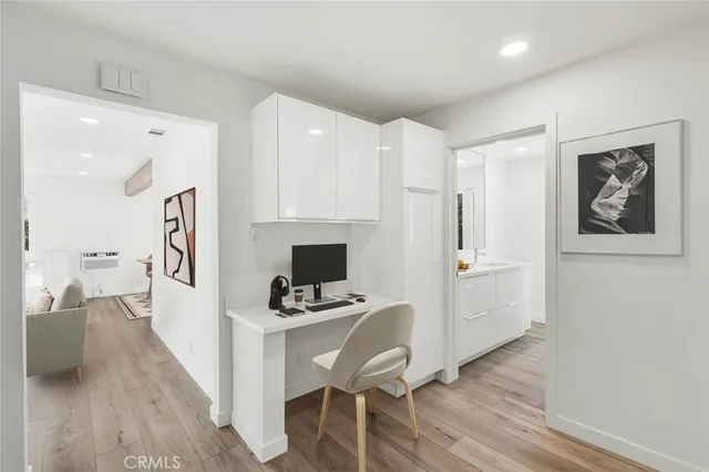 a kitchen with a refrigerator and a stove top oven