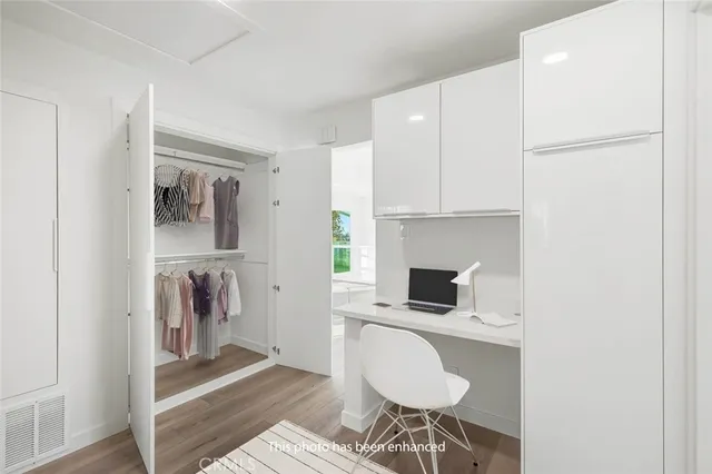 a bedroom with a bed and with furniture