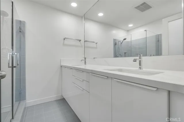 a bathroom with a shower and a shower