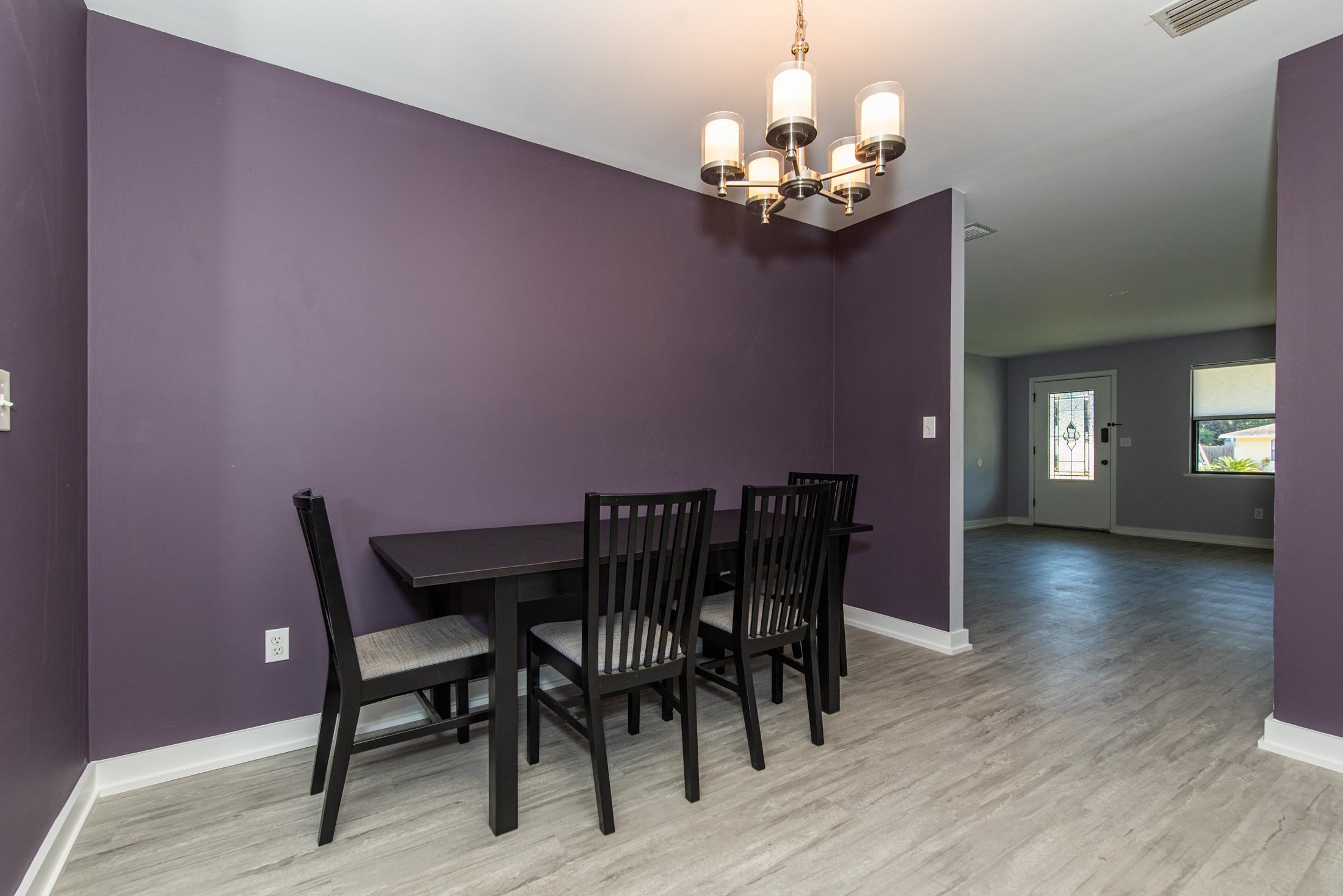 140 Orchis Road St. Augustine, FL 32086 - Photo 11 of 41 a view of a dining room with furniture and wooden floor