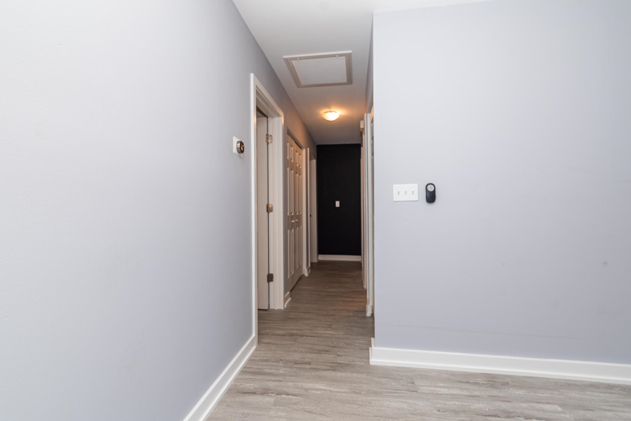 140 Orchis Road St. Augustine, FL 32086 - Photo 14 of 41 a view of hallway with closet and wooden floor