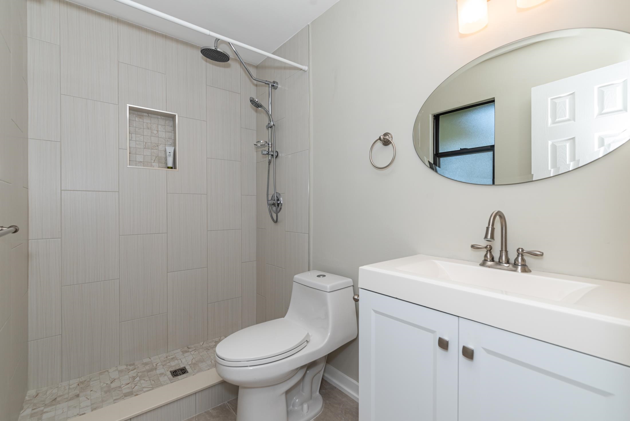 140 Orchis Road St. Augustine, FL 32086 - Photo 18 of 41 a bathroom with a sink toilet and shower