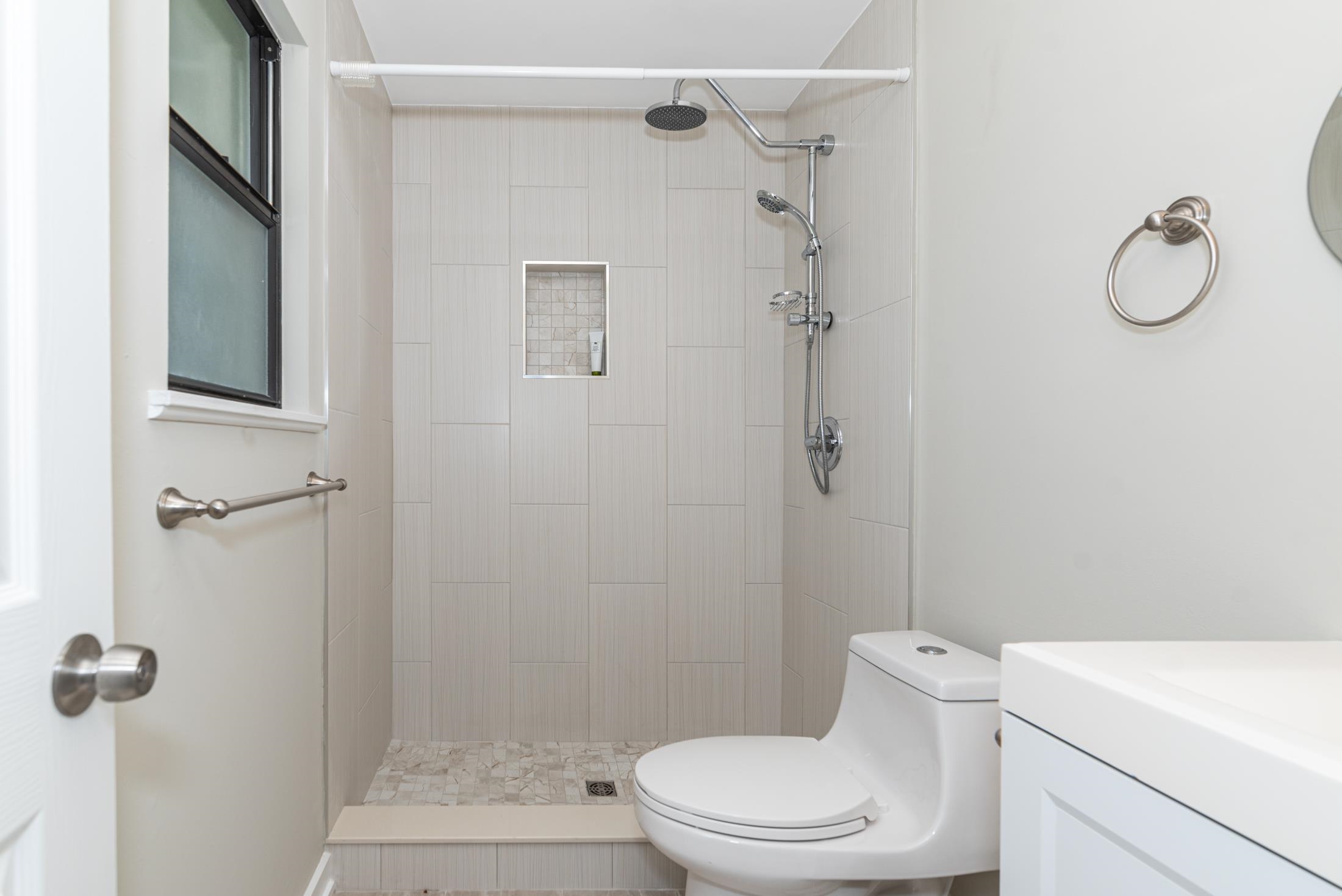 140 Orchis Road St. Augustine, FL 32086 - Photo 19 of 41 a white toilet sitting next to a bathroom