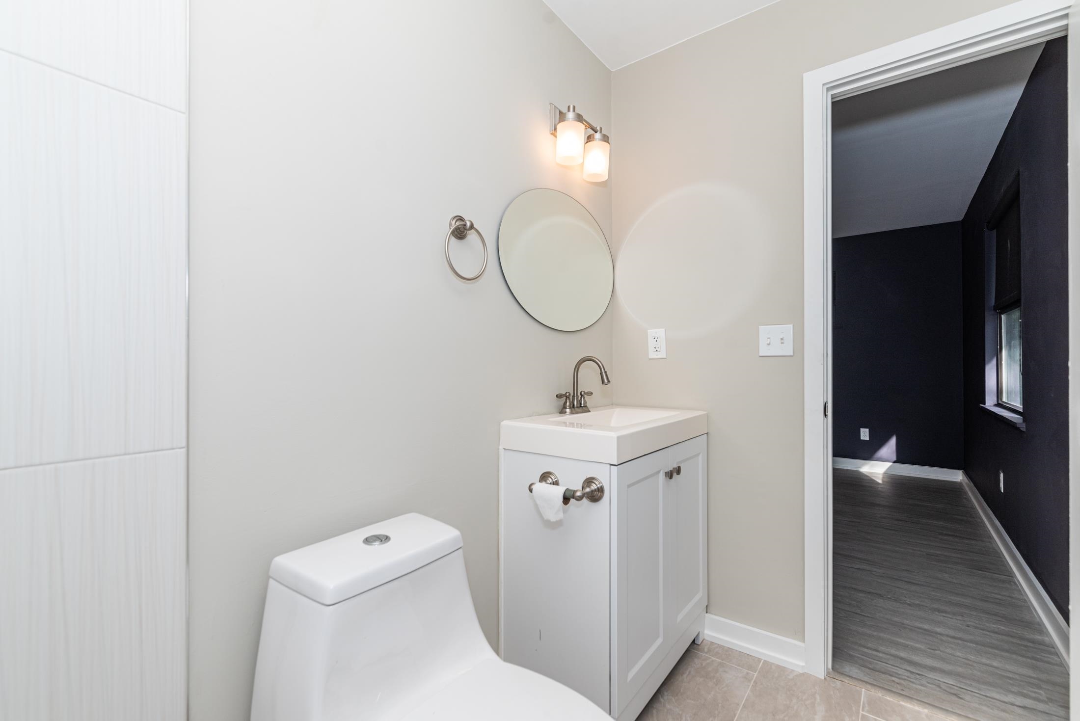 140 Orchis Road St. Augustine, FL 32086 - Photo 20 of 41 a bathroom with a toilet a sink and a mirror
