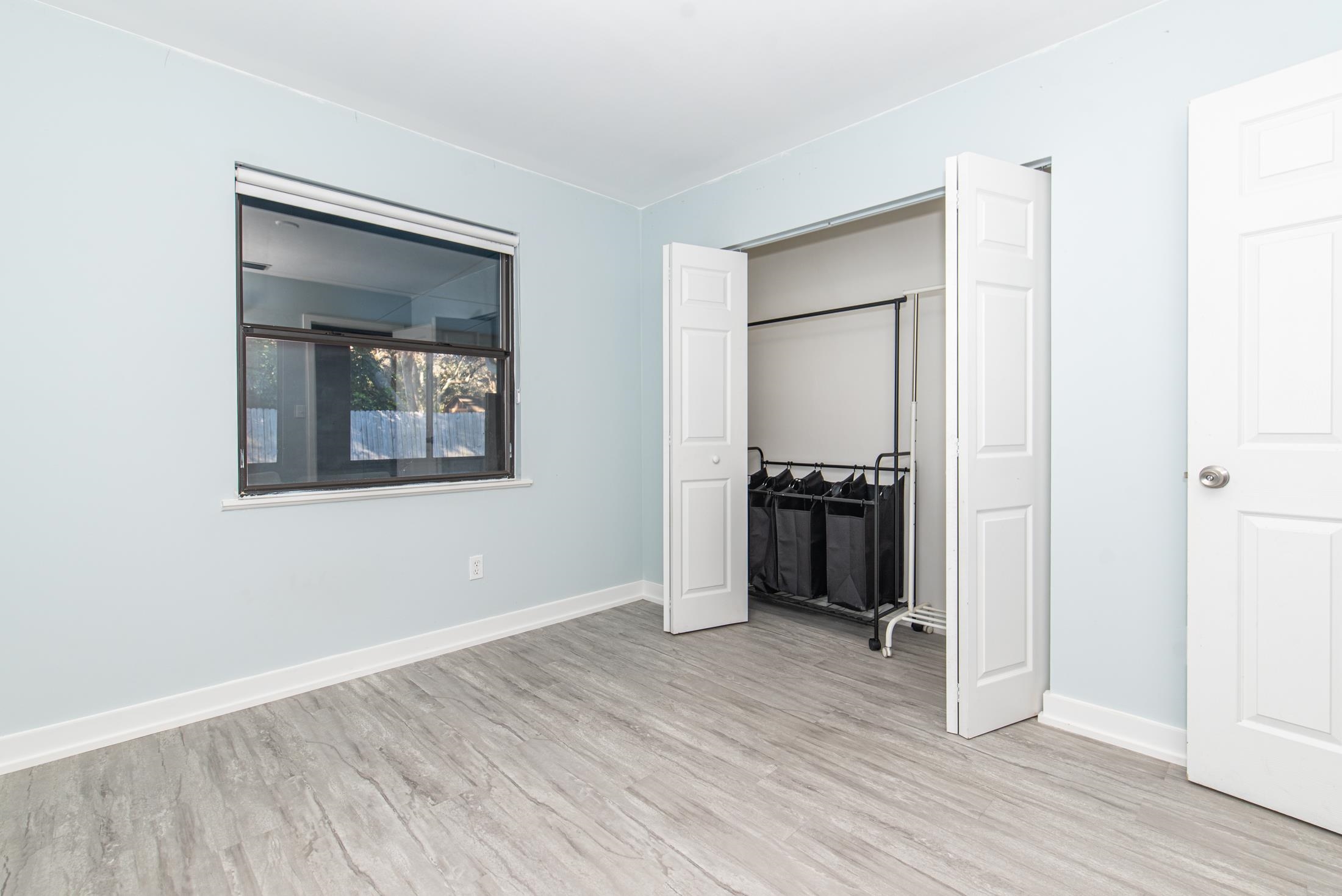 140 Orchis Road St. Augustine, FL 32086 - Photo 23 of 41 a view of an empty room with wooden floor