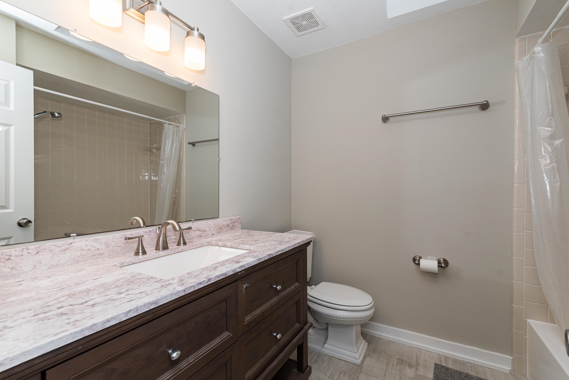 140 Orchis Road St. Augustine, FL 32086 - Photo 25 of 41 a bathroom with a granite countertop sink toilet and a mirror