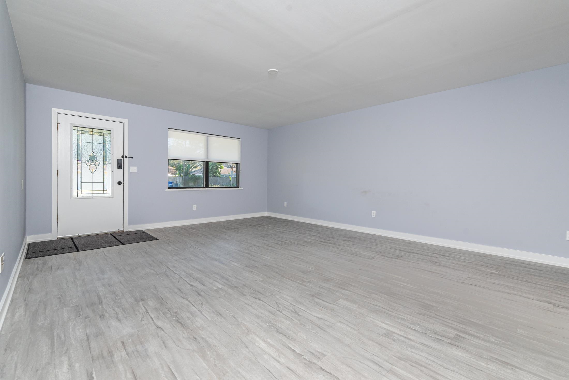 140 Orchis Road St. Augustine, FL 32086 - Photo 6 of 41 an empty room with windows