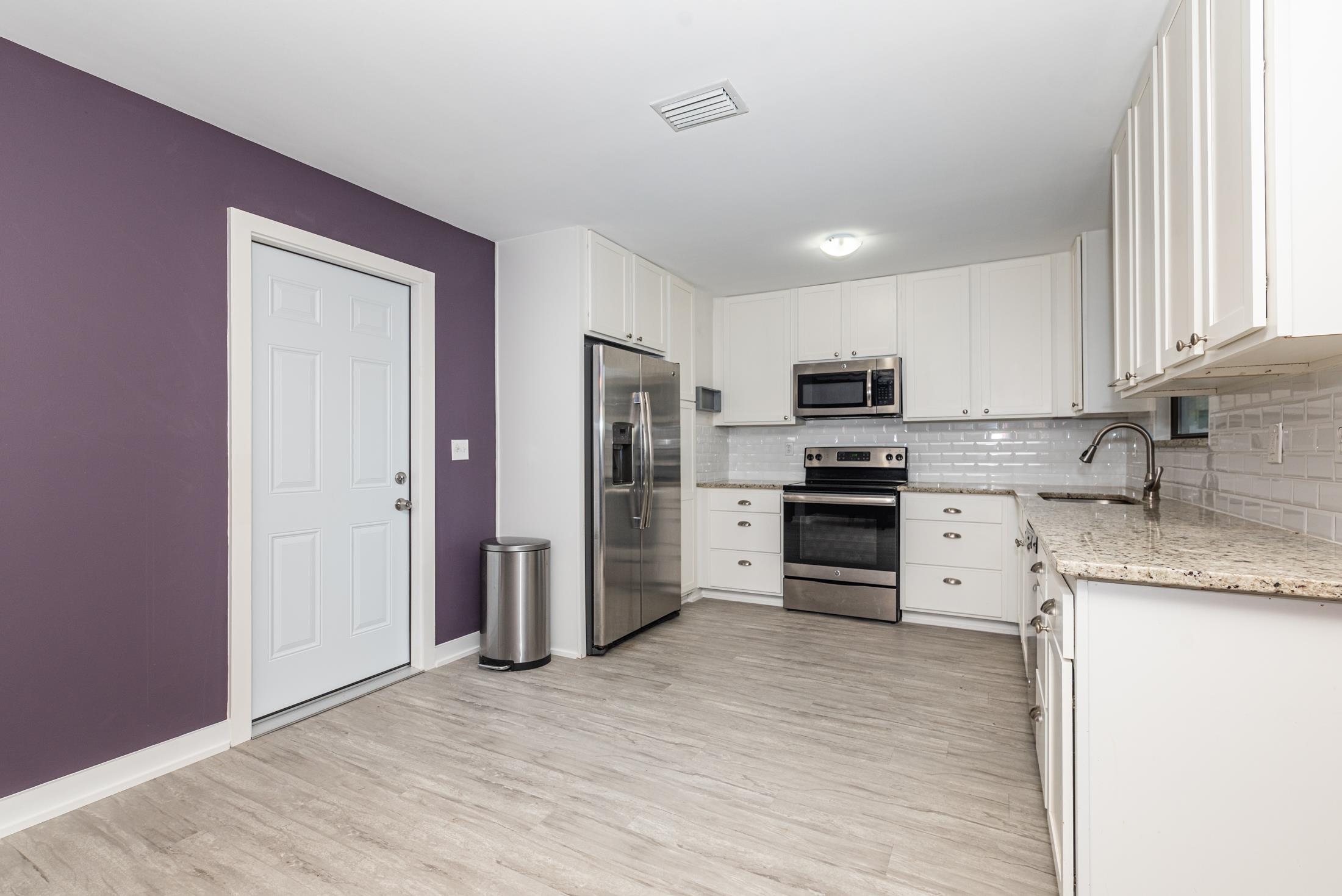 140 Orchis Road St. Augustine, FL 32086 - Photo 8 of 41 a kitchen with stainless steel appliances granite countertop a refrigerator and a stove top oven