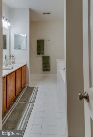 a bathroom with a sink a mirror and shower