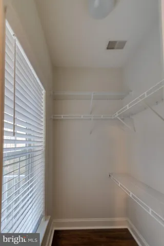 a view of a room with racks on the wall