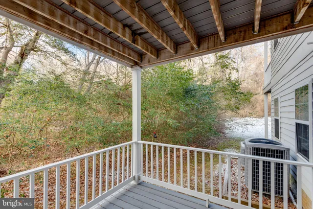 a view of a balcony with wooden floor