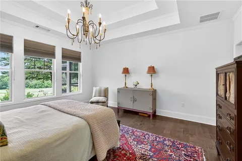 a spacious bathroom with a double vanity sink and a mirror