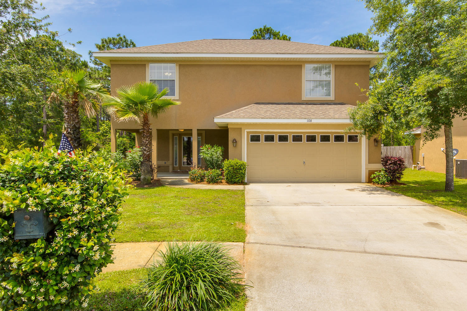 108 Red Maple Court Santa Rosa Beach, FL 32459 - Photo 1 of 30 a front view of a house with a yard and garage