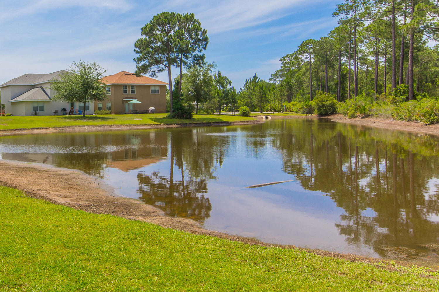108 Red Maple Court Santa Rosa Beach, FL 32459 - Photo 24 of 30 a view of a lake with houses in front of it