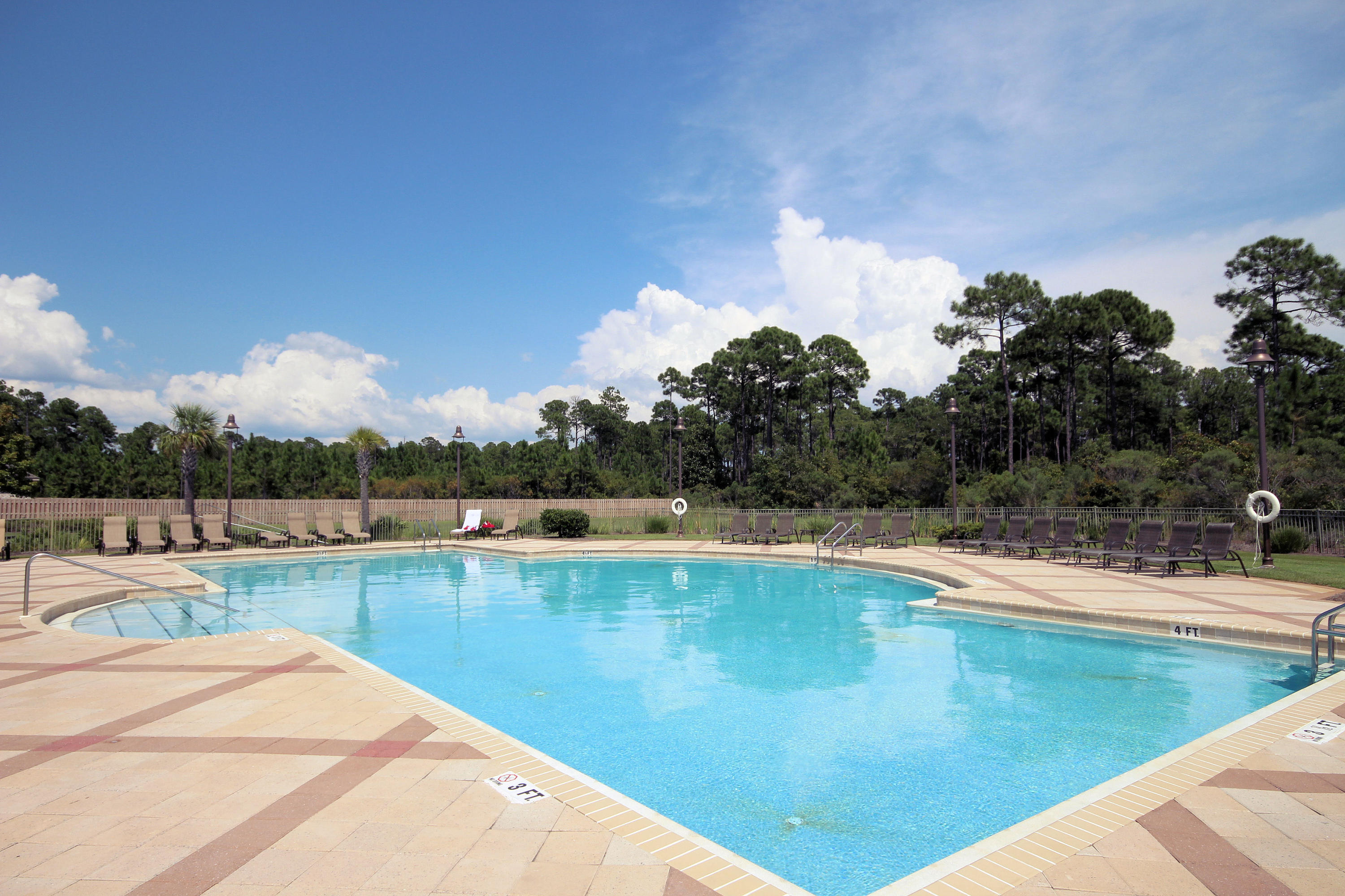108 Red Maple Court Santa Rosa Beach, FL 32459 - Photo 29 of 30 a view of a swimming pool with lake and trees in the background
