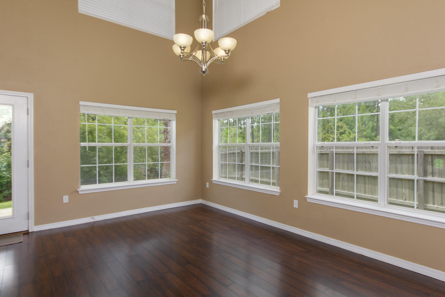 108 Red Maple Court Santa Rosa Beach, FL 32459 - Photo 9 of 30 a view of an empty room with wooden floor and a window