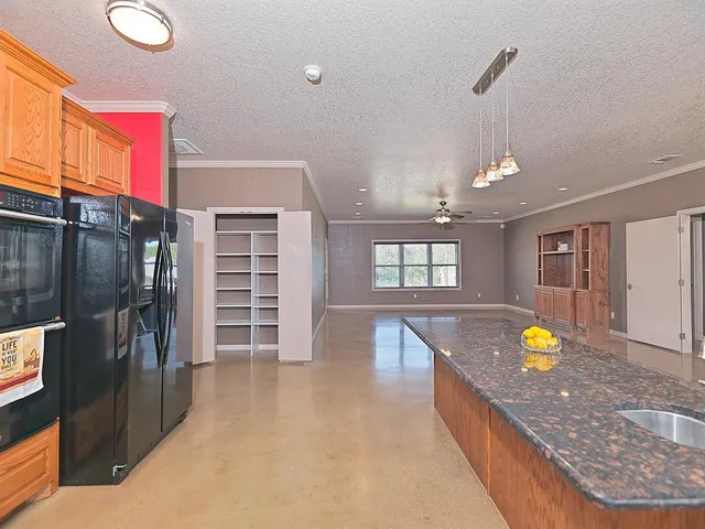 a view of an entryway and livingroom with furniture