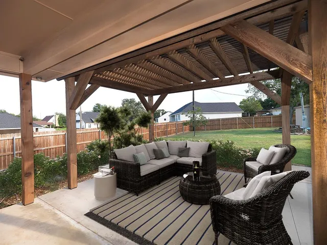 a view of a patio with couches chairs dining table and chairs