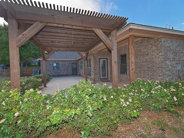 front view of a house with a garden