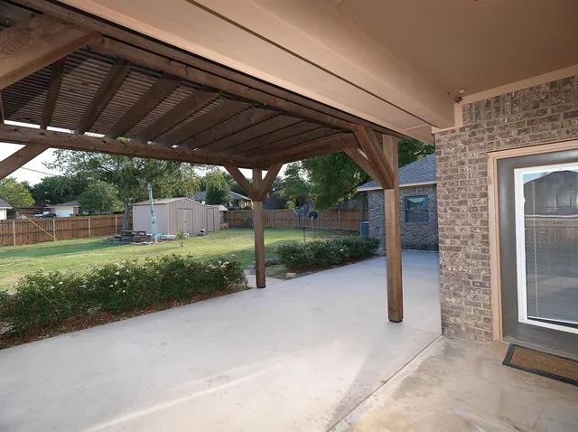 a view of a backyard with porch