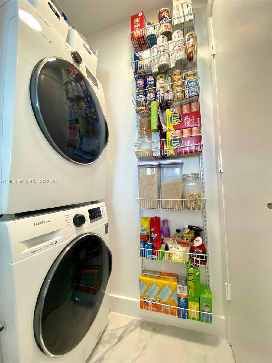 253 Northeast 2nd Street, Unit 2703 Miami, FL 33132 - Photo 24 of 33 a utility room with dryer and washer