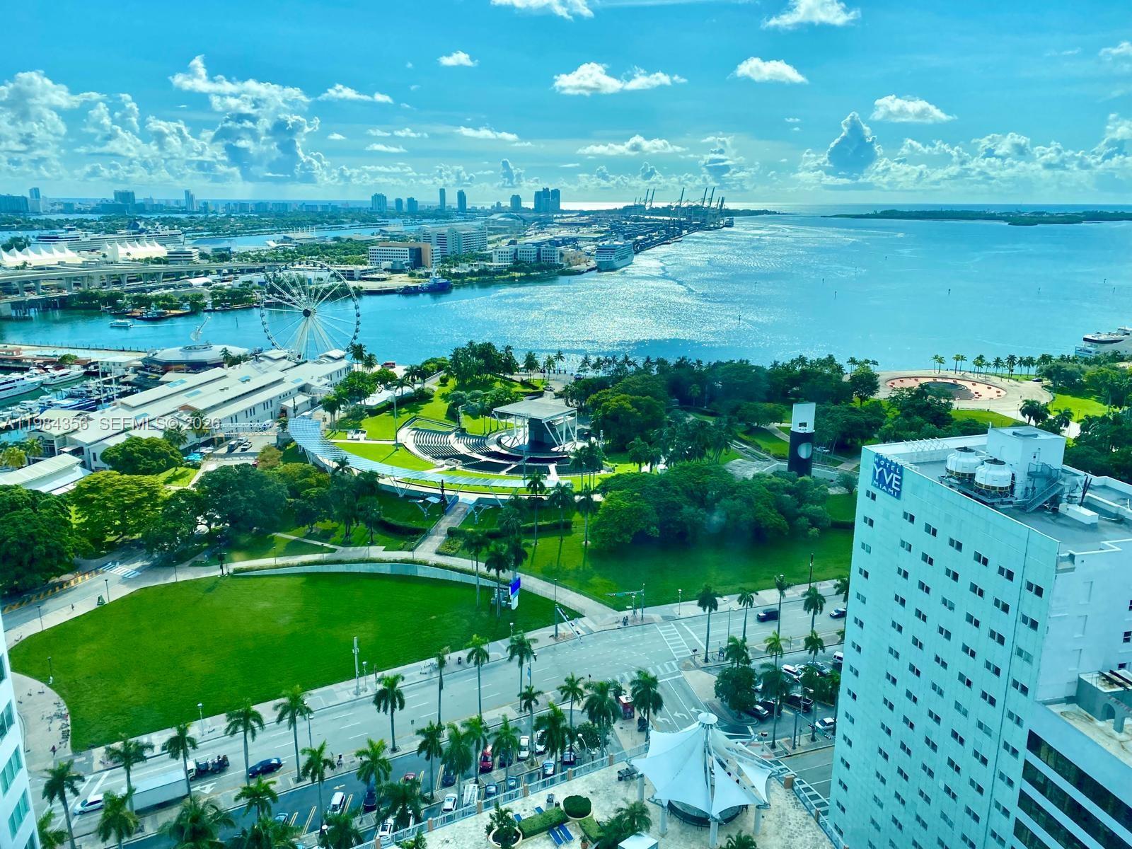 253 Northeast 2nd Street, Unit 2703 Miami, FL 33132 - Photo 32 of 33 a view of a lake with a city
